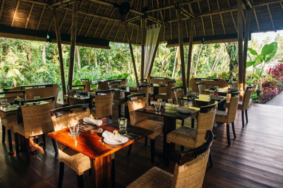 Riverside dining deck with curated hospitality seating